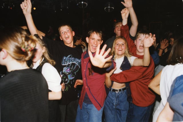 This group on the dance floor for the teens disco are having a great time
