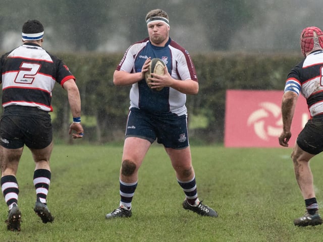 Scarborough RUFC's Tom Read is outnumbered by Malton & Norton RUFC players
