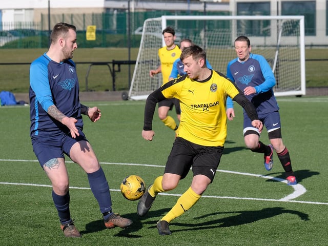 Battling for the ball in the Traf v Cayton clash