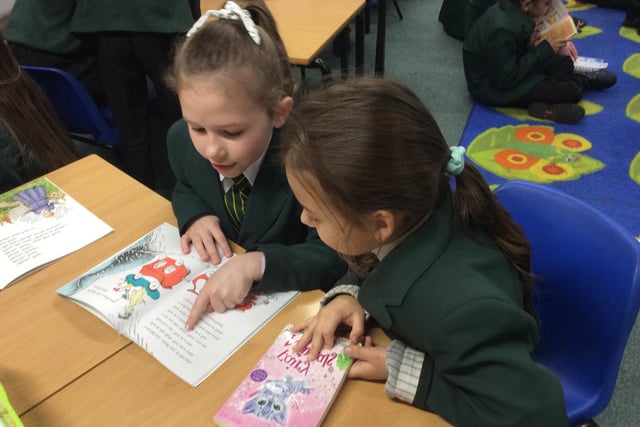 Pupils from Dashwood Academy Banbury in a buddy reading session on World Book Day with Olivia Thorpe, in Year 5 & Chloe Magda in Year 2. (photo submitted from the school)