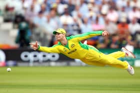 Steve Smith attempts to run out Jos Buttler as Australia beat England by 64 runs at Lord’s to qualify for the Cricket World Cup semi-finals in 2019.