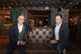 Colin Neill, Chief Executive of Hospitality Ulster, speaks to media today following the announcement of the relaxation of social distancing from 2m to 1m. He is pictured having a 1m socially distanced drink with Chris Brown in Margot Bar