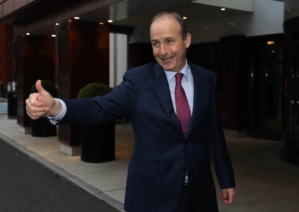 Micheal Martin, gestures after announcing that Fianna Fail members have backed a deal to restore coalition government in Ireland. He has been fiercely critical of Sinn Fein. Photo: Damien Eagers/PA Wire