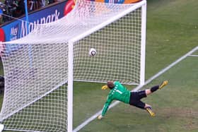 Manuel Neuer of Germany watches the ball bounce over the line from a shot that hit the crossbar from Frank Lampard of England