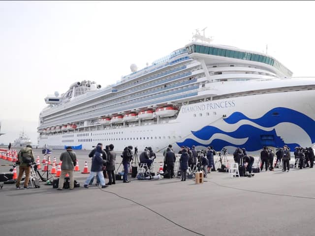 Media gather in front of the The Diamond Princess berthed in Yokohama Harbour during it’s 14 day quarantine