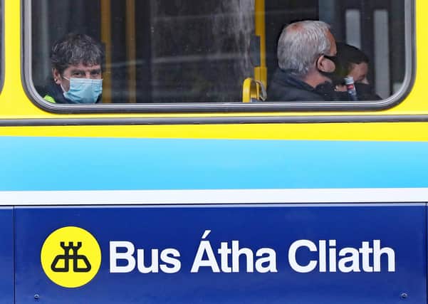 People riding a bus in Dublin wear face coverings, which are now compulsory on public transport, as Ireland enters phase three of Covid-19 lockdown restrictions. Photo: Niall Carson/PA Wire