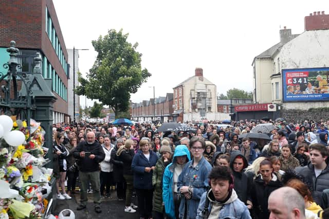 Large crowds at the gates of St Malachys school
