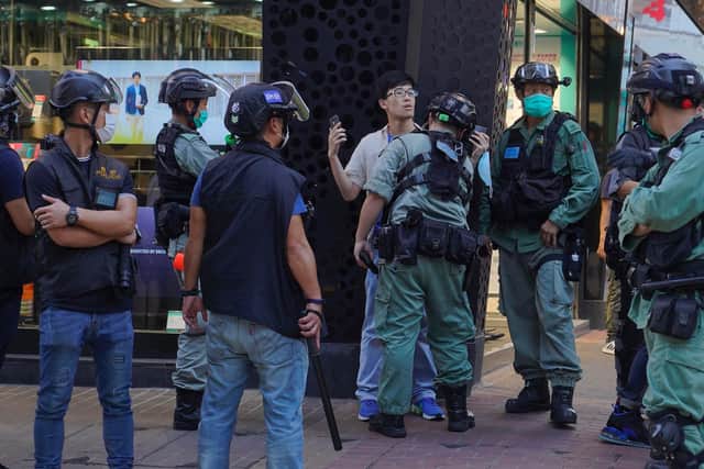 Police detain a person during a pro-democracy rally supporting human rights and to protest against Beijing's national security law in Hong Kong, Sunday, June 28, 2020. (AP Photo/Vincent Yu)
