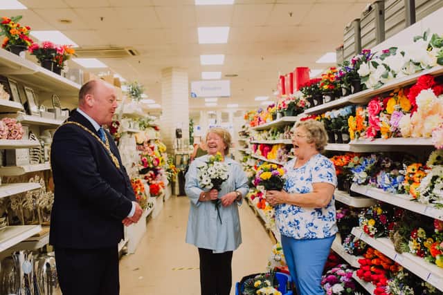 Lord Mayor or Belfast, Alderman Frank McCoubrey stopped to chat to (left to right) Joan Crawford and Mary Wilson in Wyse Byse on the Newtownards Road during his visit to local retailers in East Belfast
