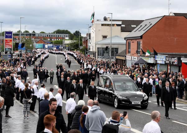 Bobby Storey’s funeral procession makes its way through west Belfast