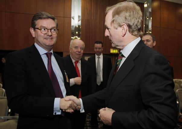 The then Taoiseach Enda Kenny is greeted by British Ambassador to Ireland Julian King (left) in Cork in 2011. Photo: Niall Carson/PA Wire