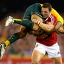 British and Irish Lions' George North tackles Australia's Isreal Folau in 2013 during the Second Test match at the Etihad Stadium, Melbourne. Pic by PA.