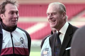 The Duke of Edinburgh shares a joke with Nottingham Forest manager David Platt during a visit to the club's City ground