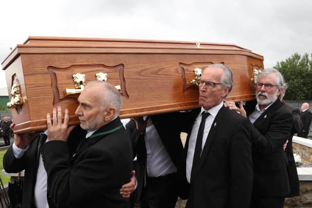 Gerry Adams and Gerry Kelly help to carry the coffin of Bobby Storey. (Photo: PA Wire)