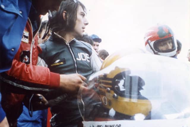 A young Joey Dunlop casts a glance towards his great rival and 'Dromara Destroyers' member Ray McCullough during the 1977 Irish road racing season.
