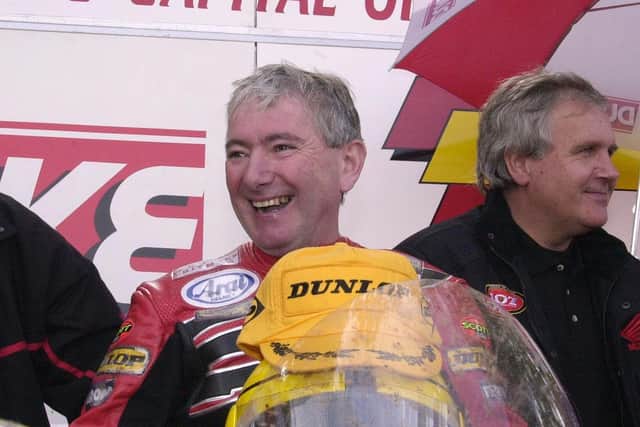 Ballymoney's Joey Dunlop in relaxed mood after winning the Formula One race at the Isle of Man TT in 2000 to record his 24th victory at the event. Joey later went on to win the 250cc and 125cc races to complete a hat-trick, setting a record total of 26 TT wins that still stands today.