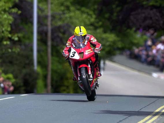 Joey Dunlop on the Honda VTR SP-1 at Ago's Leap in the Formula One race at the 2000 Isle of Man TT.