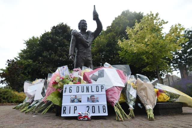 Flowers left at Robert Dunlop's statue in his memorial garden in Ballymoney in the wake of his son William's tragic death in a crash at the Skerries 100 in 2018.