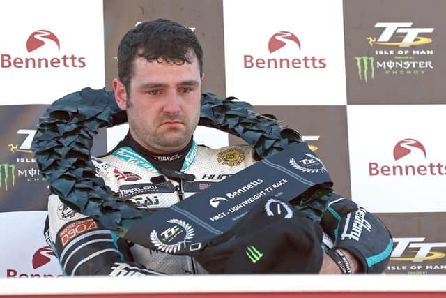 A solemn looking Michael Dunlop on the podium at the Isle of Man TT in 2019 after claiming his 19th win with victory in the Lightweight race.