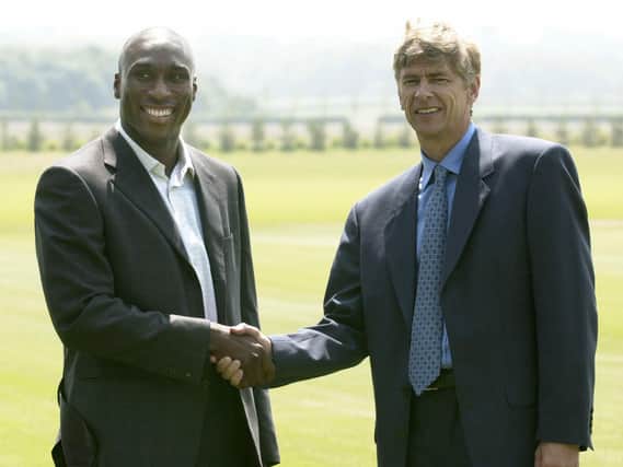 Sol Campbell is welcomed to Arsenal by manager Arsene Wenger