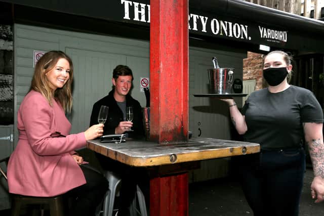 PACEMAKER PRESS BELFAST
3/7/2020
Pubs, cafes and restaurants in Northern Ireland welcome customers back today after easing of the lockdown restrictions imposed by Covid-19. 
Pictured: Lauran Wilson and Jonny Murphy enjoying some prosecco in The Dirty Onion.
Photo Pacemaker Press