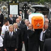 Bobby Storey's coffin is draped in the Irish tricolour as it is carried through Milltown Cemetery. The coffin was then taken to Roselawn Crematorium for a private service. (Photo: PA Wire)