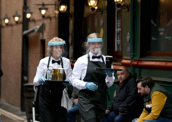 People in Belfast city centre on Friday as the re-opening of hotels, restaurants and bars across Northern Ireland takes place after the lockdown process.

The Morning star

Photo by Matt Mackey / Press Eye.