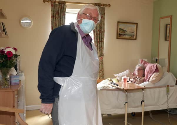 William Barr visiting his wife Jean, a resident in Cregagh Nursing Home, Belfast, for the first time in 12 weeks