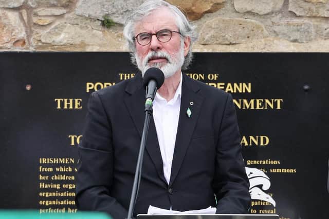 Former President of Sinn Fein, Gerry Adams, addresses mourners at the funeral of Bobby Storey in Milltown Cemetery