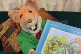 Basil Brush with a copy of the story