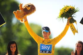 Bradley Wiggins of Sky Pro Racing celebrates on the winners podium after winning the 2012 Tour de France in Paris.