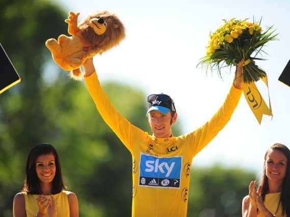 Bradley Wiggins of Sky Pro Racing celebrates on the winners podium after winning the 2012 Tour de France in Paris.