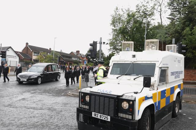 The PSNI pictured as the funeral cortege makes its way to Milltown Cemetery in Belfast. (Photo: PA Wire)