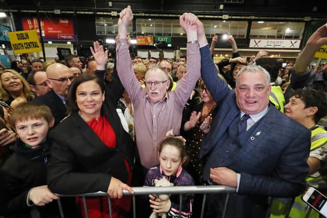 Mary Lou McDonald TD earlier this year celebrates the election of her Sinn Fein colleague Dessie Ellis, a former IRA prisoner, to the Dail at the election count at the RDS in Dublin. Their fellow TD Aengus O Snodaigh is on the right