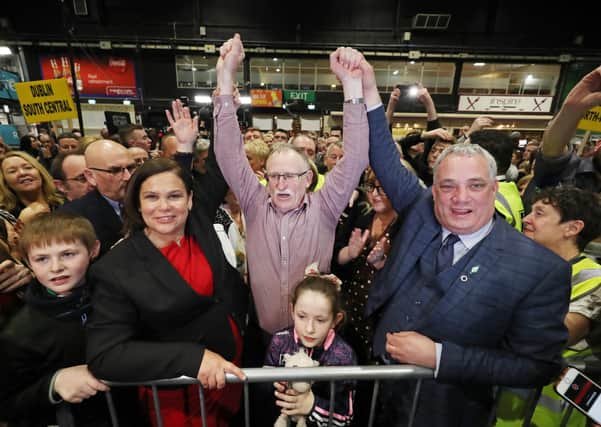 Mary Lou McDonald TD earlier this year celebrates the election of her Sinn Fein colleague Dessie Ellis, a former IRA prisoner, to the Dail at the election count at the RDS in Dublin. Their fellow TD Aengus O Snodaigh is on the right