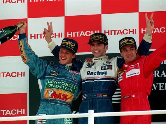 Britain's Damon Hill (center) on the winners Rostrum with second placed Michael Schumacher (left) and Jean Alesi