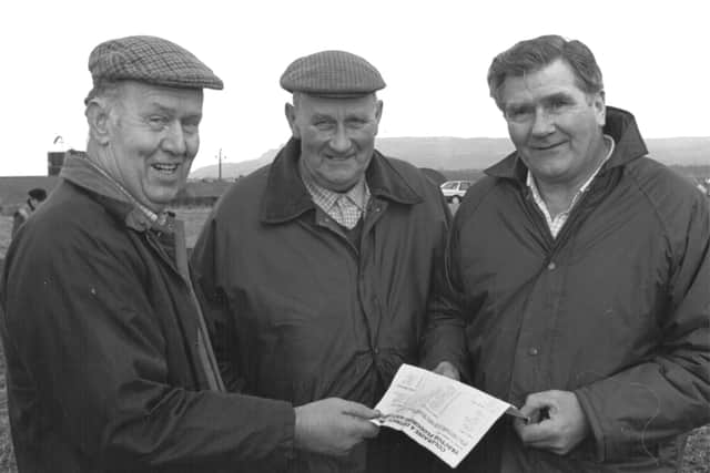 Ivor McPherson, Ringsend, James Knox, Aghadowey, and Sam Weir, Boveagh, checking the entries at the annual Coleraine and District Ploughing Society competition which was held at Limavady. Picture: Farming Life archives