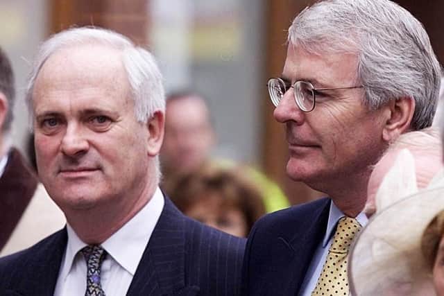 The former Taoiseach John Bruton, left, with the former UK Prime Minister John Major, in 2000, three years after both left office, in Warrington to commemorate the anniversary of the murder of two children, Tim Parry and Jonathan Ball, in IRA bombs