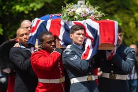 Service personnel carrying the coffin of forces sweetheart Dame Vera Lynn into the Brighton Crematorium, East Sussex.
