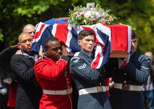 Service personnel carrying the coffin of forces sweetheart Dame Vera Lynn into the Brighton Crematorium, East Sussex.