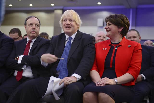 Boris Johnson alongside Nigel Dodds and Arlene Foster at the DUP conference in November 2018. He was cheered to the rafters when he promised he would never let NI be reduced to semi-colony status, via a border in the Irish Sea