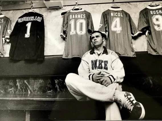 Rodney McAree pictured in the Anfield changing room with some famous names behind him. PICTURE: Oliver McVeigh