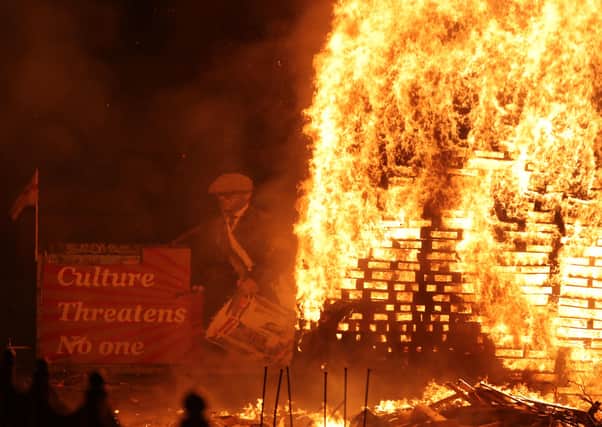 A bonfire is lit on Belfast's Lower Newtownards Road. Picture: Niall Carson/PA Wire