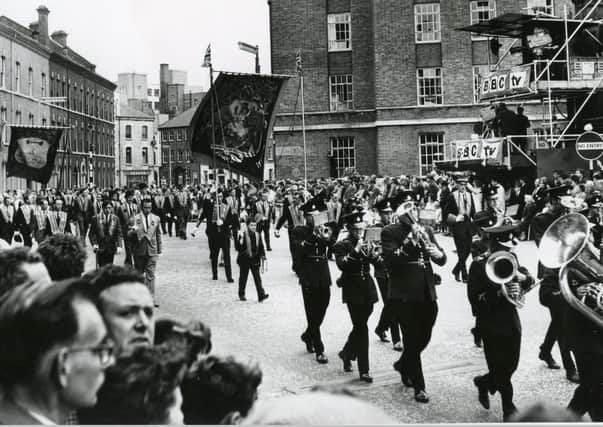 The July 12 parade of 1960 passes BBC Broadcasting House as it makes its way down the Dublin Road in Belfast