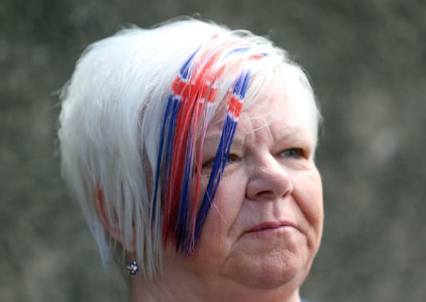 PACEMAKER, BELFAST, 13/7/2020: A Union Jack hairstyle for watching the bands parade around the streets in the Shankill area of Belfast today