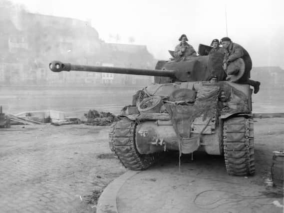 A British Sherman 'Firefly' tank patrolling the Meuse at Namur in 1944