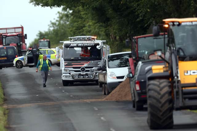 The scene of a crash involving two cars and a tractor on the Seven Mile Straight outside Antrim today