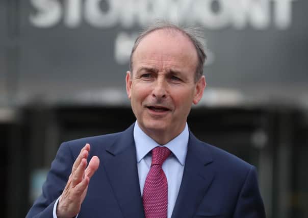 Micheal Martin talks to the media during his visit to Belfast