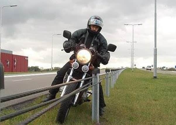 An image of a rider and the wire barrier