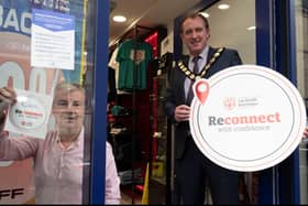 Chair of Mid Ulster District Council, Councillor Cathal Mallaghan is pictured with shop owner Stephen Mohan